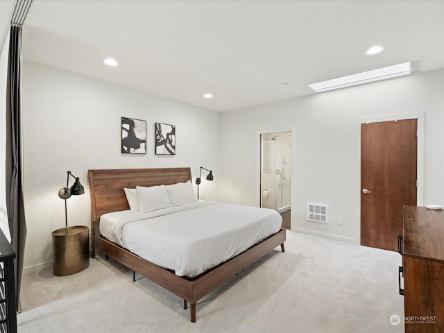 carpeted bedroom featuring connected bathroom