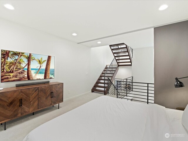 bedroom featuring light colored carpet