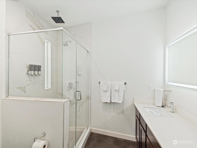 bathroom with vanity, an enclosed shower, and tile patterned flooring