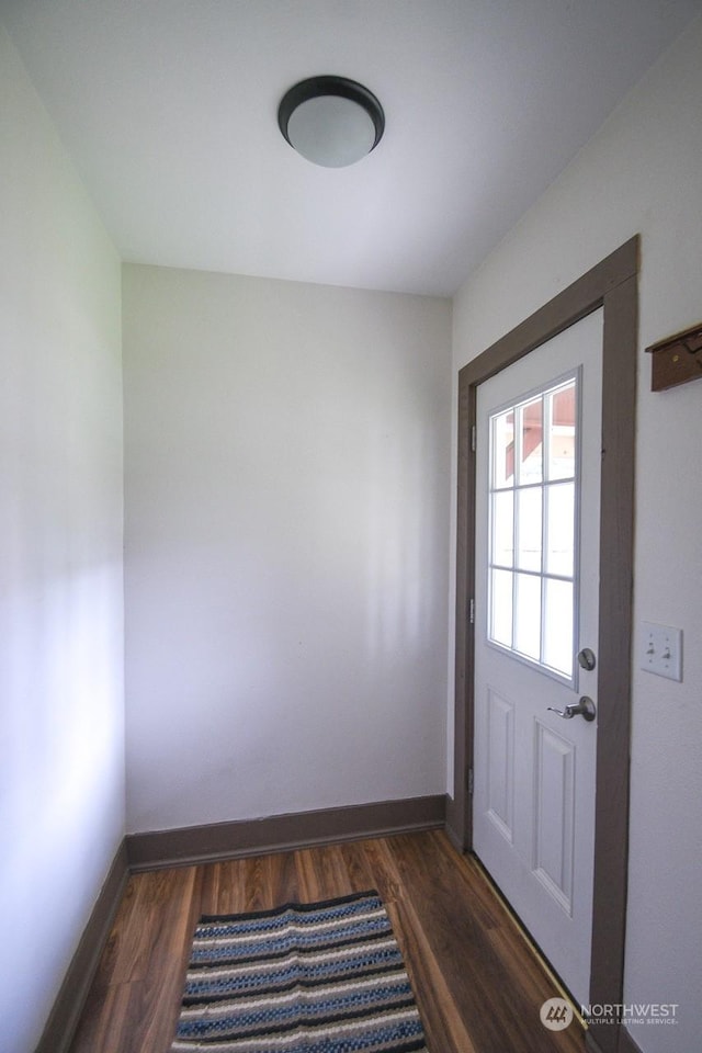 doorway to outside with dark hardwood / wood-style floors