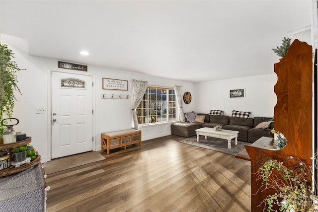 living room with dark hardwood / wood-style floors