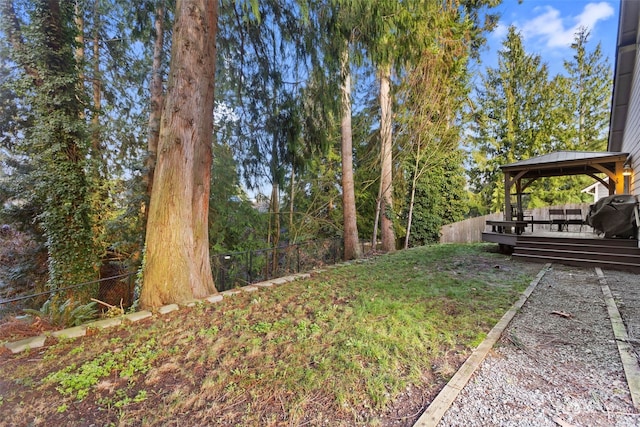 view of yard featuring a gazebo and a wooden deck