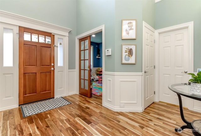 foyer entrance with light hardwood / wood-style floors