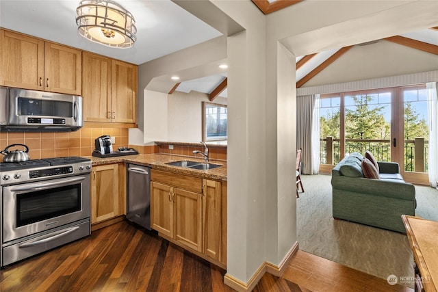 kitchen with appliances with stainless steel finishes, tasteful backsplash, sink, dark hardwood / wood-style flooring, and lofted ceiling with beams