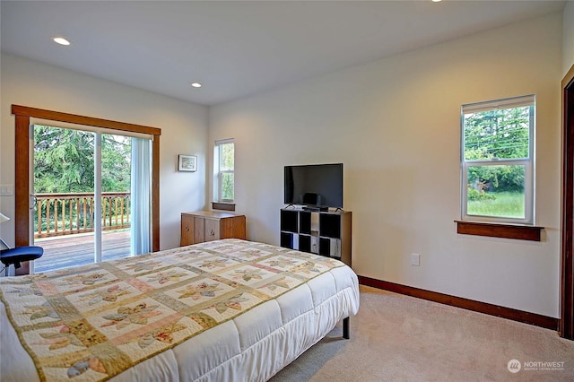 bedroom with carpet floors and access to exterior