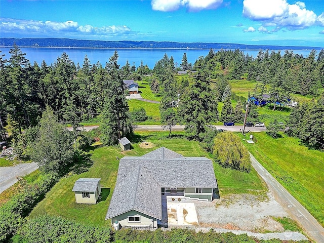 birds eye view of property with a water view