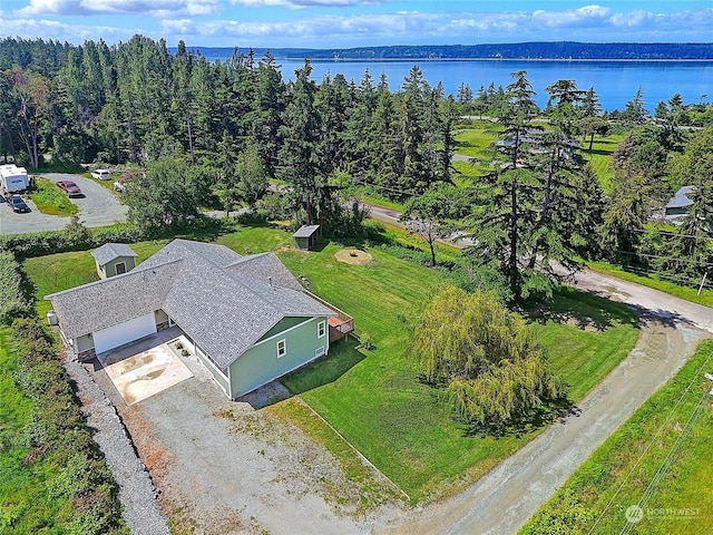 birds eye view of property with a water view