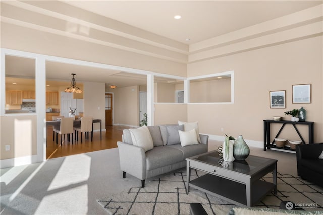 living room featuring an inviting chandelier