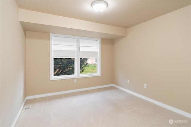 empty room featuring light colored carpet