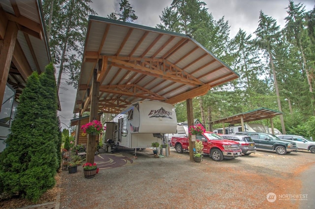 view of vehicle parking featuring a carport