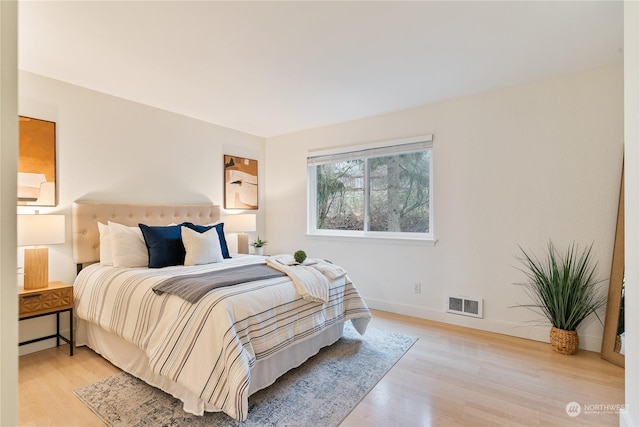 bedroom with light wood-type flooring