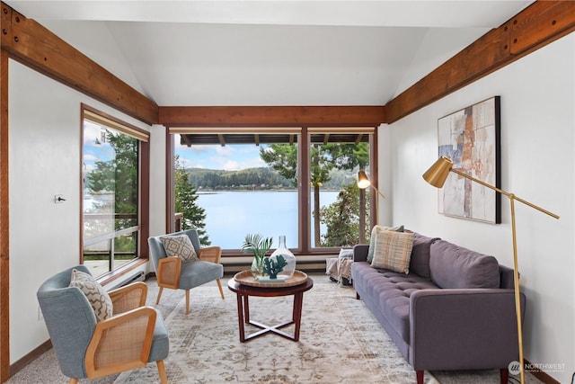 living room with vaulted ceiling, a water view, and light carpet