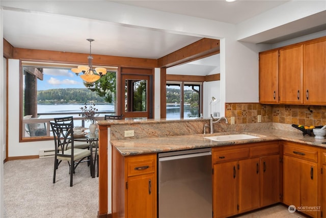 kitchen with sink, a water view, decorative light fixtures, dishwasher, and a notable chandelier