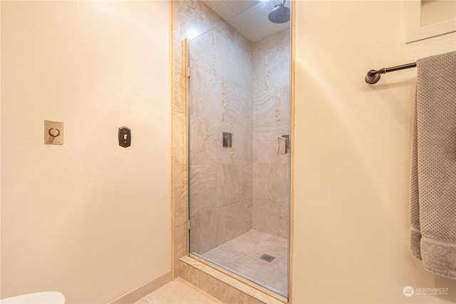 bathroom with a tile shower