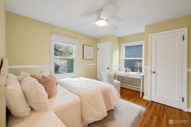 bedroom featuring hardwood / wood-style floors and ceiling fan