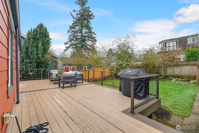 wooden deck with a yard, an outdoor hangout area, and a grill