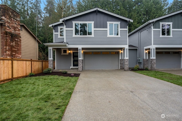 view of front of property with a front lawn and a garage