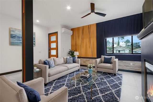 living room featuring a wall unit AC and ceiling fan