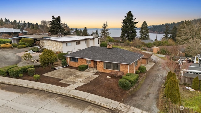 view of front of home with a water view