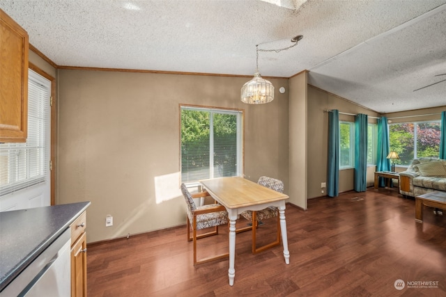 dining room featuring crown molding, dark hardwood / wood-style floors, and a wealth of natural light