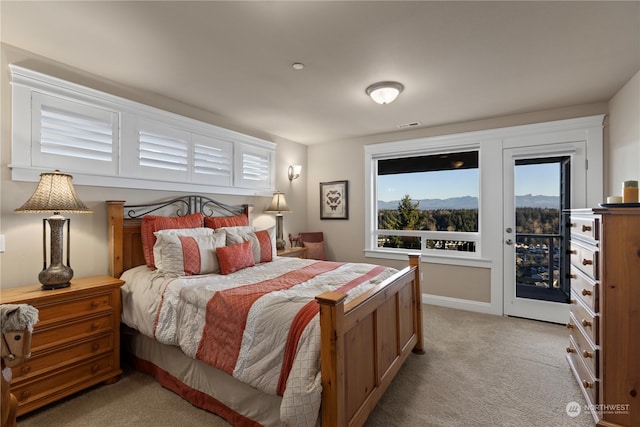 carpeted bedroom with access to outside