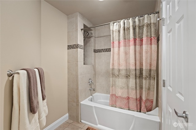 bathroom with tile patterned floors and shower / bath combo with shower curtain