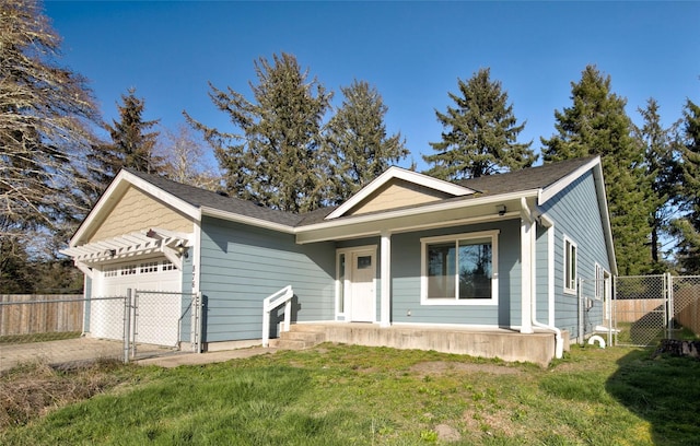 ranch-style home with an attached garage, fence, a gate, and a front yard