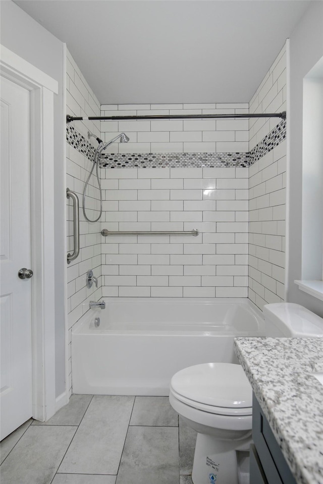 full bathroom with toilet, tile patterned floors, vanity, and shower / bathtub combination