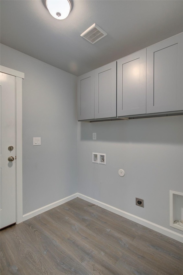 laundry area with washer hookup, dark wood-style flooring, visible vents, cabinet space, and hookup for an electric dryer