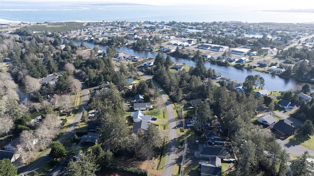 bird's eye view featuring a water view and a residential view