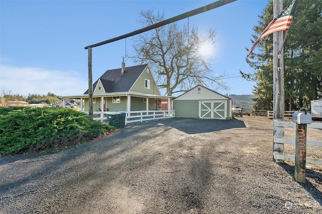 view of side of property with an outdoor structure