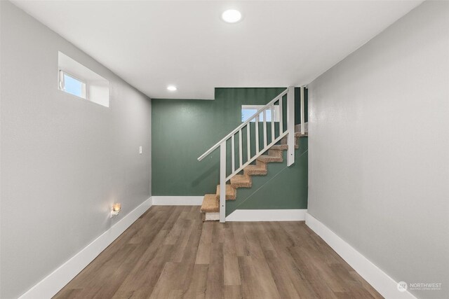 staircase featuring hardwood / wood-style floors