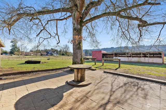 view of home's community featuring a patio area and a yard