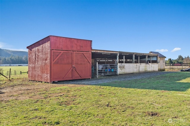 view of outdoor structure with a rural view