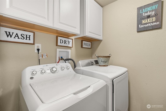 laundry area featuring cabinets and separate washer and dryer