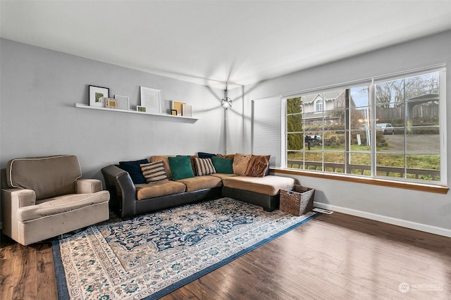 living room featuring hardwood / wood-style floors and a healthy amount of sunlight