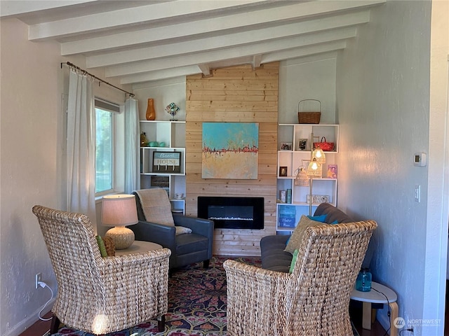 living room with a fireplace and lofted ceiling with beams