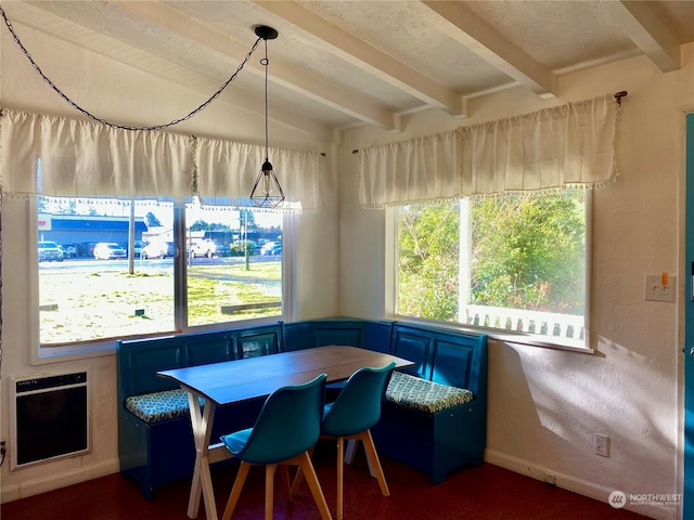 dining area with vaulted ceiling with beams, breakfast area, and heating unit