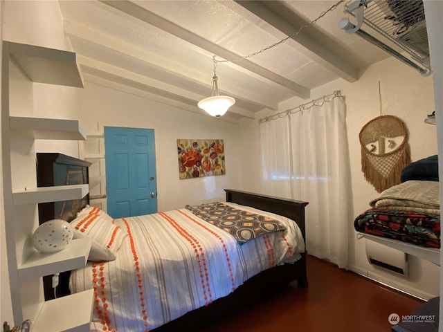 bedroom featuring lofted ceiling with beams