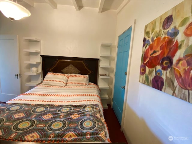 bedroom with beamed ceiling