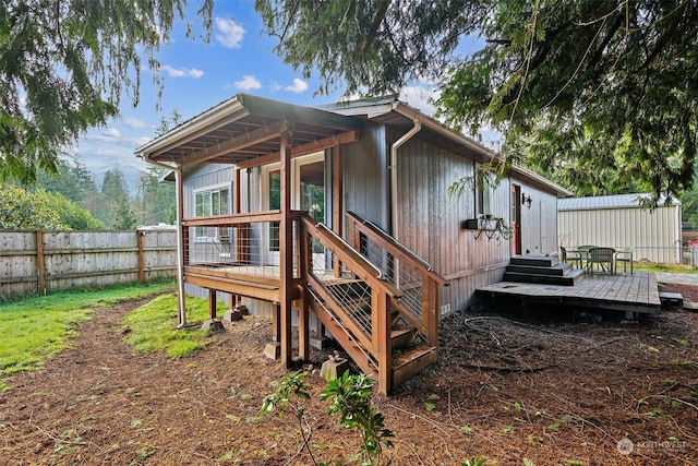 rear view of property with a deck