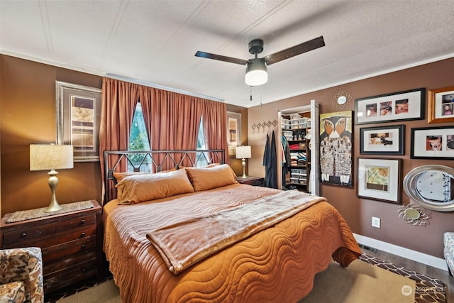 bedroom featuring a textured ceiling and ceiling fan