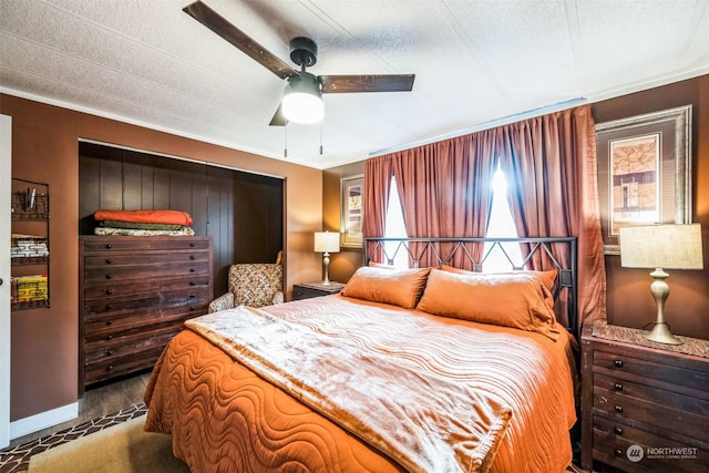 bedroom with a textured ceiling and ceiling fan