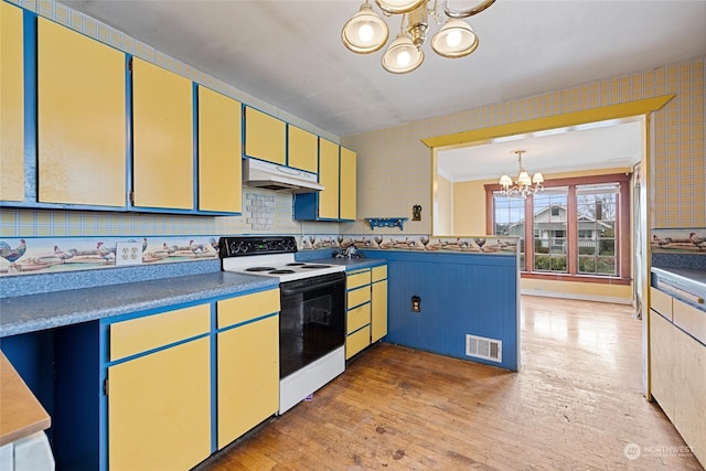 kitchen with a chandelier, electric range oven, decorative backsplash, light hardwood / wood-style flooring, and decorative light fixtures