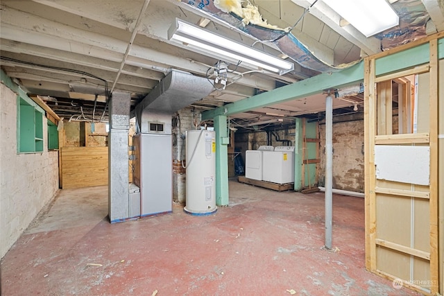 basement with washing machine and dryer and water heater