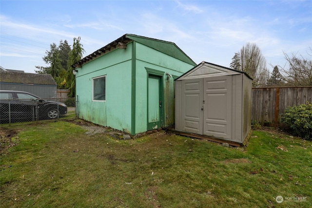 view of outbuilding with a lawn