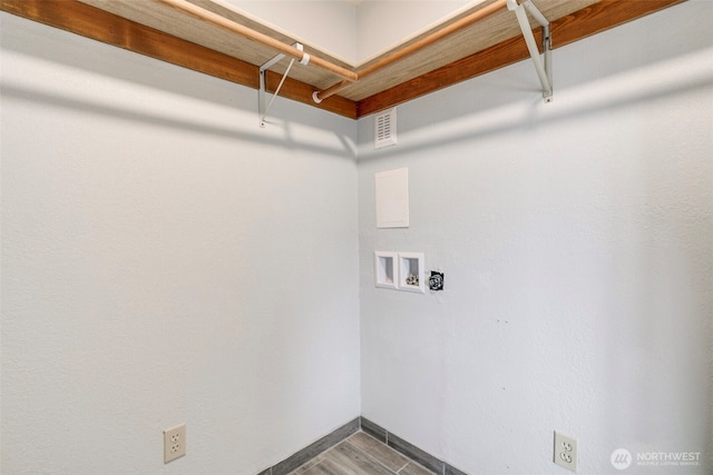 clothes washing area featuring laundry area, washer hookup, visible vents, baseboards, and dark wood finished floors