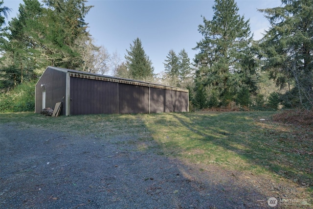 view of yard featuring an outbuilding and an outdoor structure