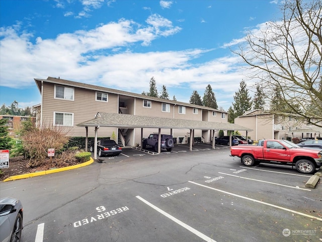 view of vehicle parking featuring a carport