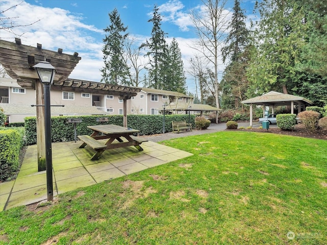 view of yard featuring a gazebo and a pergola